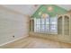 Inviting living space with built-in cabinets and charming window with shuttered blinds for a cozy feel at 8774 Adaline St, North Charleston, SC 29406