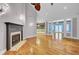 Spacious living room featuring a fireplace, high ceilings, and beautiful hardwood floors at 8774 Adaline St, North Charleston, SC 29406
