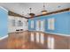 Bright living room with built-in shelving and views of the pool at 8774 Adaline St, North Charleston, SC 29406