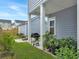 Outdoor space showcases a detached garage, grill, and lush landscaping at 886 Clay Field Trl, Summerville, SC 29485