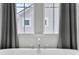 Chrome faucet with a relaxing view from the bathroom window at 886 Clay Field Trl, Summerville, SC 29485