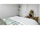 Cozy bedroom with a bed featuring a quilt, side table, and wooden floors at 886 Clay Field Trl, Summerville, SC 29485