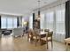 Inviting dining room featuring a wooden table and chairs with a decorative pendant light at 886 Clay Field Trl, Summerville, SC 29485