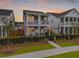 Charming two-story home with a welcoming front porch and second story balcony at 886 Clay Field Trl, Summerville, SC 29485