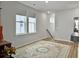 Well-lit living room featuring a decorative rug with staircase leading up to the second story at 886 Clay Field Trl, Summerville, SC 29485