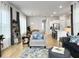 Cozy living room showcasing stylish decor, natural light, and open space to the kitchen at 886 Clay Field Trl, Summerville, SC 29485