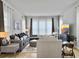 Spacious living room featuring modern furnishings, decor, and abundant natural light from the windows at 886 Clay Field Trl, Summerville, SC 29485