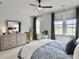 Bright bedroom with a view, natural lighting, and soft neutral tones at 886 Clay Field Trl, Summerville, SC 29485