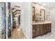 Bathroom featuring double sink vanity, hardwood floors, and marble shower at 9822 Haven Loop, Johns Island, SC 29455