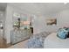 Bright bedroom featuring a light blue dresser and floral patterned bedspread with white bedding at 9822 Haven Loop, Johns Island, SC 29455