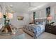 Bright bedroom featuring elegant furnishings and stylish decor, including a patterned bedspread and floral accents at 9822 Haven Loop, Johns Island, SC 29455