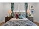 Well-appointed bedroom with patterned bedding and decorative pillows complemented by stylish bedside lamps and artwork at 9822 Haven Loop, Johns Island, SC 29455