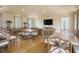 Spacious common room with ample seating, a large TV, and tasteful decor for various activities at 9822 Haven Loop, Johns Island, SC 29455