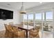 Bright dining room with a large table and scenic water views, creating a serene dining experience at 9822 Haven Loop, Johns Island, SC 29455