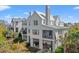 Stylish multi-story home with screened porches and outdoor living spaces, blending seamlessly with the verdant surroundings at 9822 Haven Loop, Johns Island, SC 29455