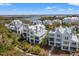 Elegant two-story home with outdoor living spaces nestled within a lush landscape and community sidewalks at 9822 Haven Loop, Johns Island, SC 29455