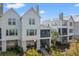 Stylish multi-story home with screened porches and outdoor living spaces, blending seamlessly with the verdant surroundings at 9822 Haven Loop, Johns Island, SC 29455