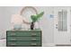 Inviting foyer features a stylish green dresser with modern decor and a round mirror at 9822 Haven Loop, Johns Island, SC 29455