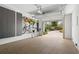 Well-lit garage featuring epoxy floors, wall organization, and an open door to the outside at 9822 Haven Loop, Johns Island, SC 29455