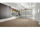 Organized garage with epoxy flooring, storage cabinets, and slat wall for hanging items at 9822 Haven Loop, Johns Island, SC 29455