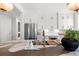 Bright kitchen featuring marble counters, white cabinetry, stainless steel appliances, and modern fixtures at 9822 Haven Loop, Johns Island, SC 29455