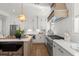 Updated kitchen with stainless steel appliances, white cabinets, and a large island at 9822 Haven Loop, Johns Island, SC 29455