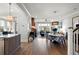 Open living space with hardwood floors, dining area, and a cozy living room layout at 9822 Haven Loop, Johns Island, SC 29455