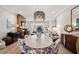 Spacious living area with fireplace, open to dining featuring stylish furniture, decor and natural light at 9822 Haven Loop, Johns Island, SC 29455