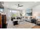 Bright living room featuring a fireplace, hardwood floors, modern furnishings, and a painting on the wall at 9822 Haven Loop, Johns Island, SC 29455