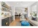 Comfortable living room with hardwood floors, a bar area, and a view to the kitchen at 9822 Haven Loop, Johns Island, SC 29455