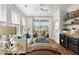 Well-lit living room with a view to the balcony, comfortable seating, and stylish accents at 9822 Haven Loop, Johns Island, SC 29455