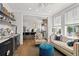Inviting living room showcasing a bar area, hardwood floors, and an open view to the kitchen at 9822 Haven Loop, Johns Island, SC 29455