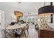 Open-concept living and dining areas with hardwood floors, fireplace, and elegant decor creating a welcoming space at 9822 Haven Loop, Johns Island, SC 29455