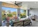 Outdoor living space featuring a fireplace, comfortable seating, ceiling fans, and a view of the property at 9822 Haven Loop, Johns Island, SC 29455