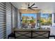 Relaxing outdoor living area with ceiling fans, stylish furniture, and natural views at 9822 Haven Loop, Johns Island, SC 29455