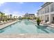 Resort-style pool with plenty of lounge chairs, palm trees, and covered cabanas for relaxing on a sunny day at 9822 Haven Loop, Johns Island, SC 29455