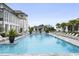 Serene pool area with ample lounge chairs and poolside gazebo at 9822 Haven Loop, Johns Island, SC 29455