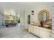 Charming porch with comfortable seating, an ornate mirror and an entry door at 9822 Haven Loop, Johns Island, SC 29455