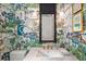 Stylish powder room with scenic wallpaper, marble countertop, and unique fixtures creating an elegant space at 9822 Haven Loop, Johns Island, SC 29455