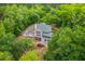 Aerial view of the home nestled in the trees, showcasing the large lot and tranquil setting at 100 Canal Rd, Saint George, SC 29477