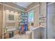 Well-organized bathroom with open shelving, white fixtures, and decorative accents at 100 Canal Rd, Saint George, SC 29477