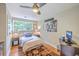Bright bedroom with a hardwood floor, decorative rug, and a view of outside at 100 Canal Rd, Saint George, SC 29477