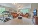 Spacious bonus room with TV, comfortable seating, and a treadmill for exercise at 100 Canal Rd, Saint George, SC 29477