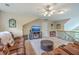 Upstairs bonus room with TV, comfortable seating, and plenty of space for entertainment at 100 Canal Rd, Saint George, SC 29477