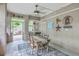 Cozy dining area with rustic table, chairs, and outdoor access to a staircase at 100 Canal Rd, Saint George, SC 29477