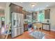 Kitchen features stainless steel appliances, dark wood cabinets, and an eat-in area at 100 Canal Rd, Saint George, SC 29477