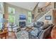 Comfortable living room boasts a fireplace, staircase, and lots of seating at 100 Canal Rd, Saint George, SC 29477
