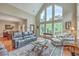 Spacious living room featuring high ceilings, ample natural light, and stylish furnishings at 100 Canal Rd, Saint George, SC 29477