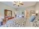 Bright primary bedroom featuring neutral carpet and dual access to bathroom at 100 Canal Rd, Saint George, SC 29477