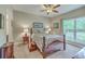 Cozy bedroom with carpet, ceiling fan, and a window that offers a view at 100 Canal Rd, Saint George, SC 29477
